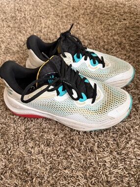 Under Armour Men’s Steph Curry White Athletic Shoes with Black and Teal Accents